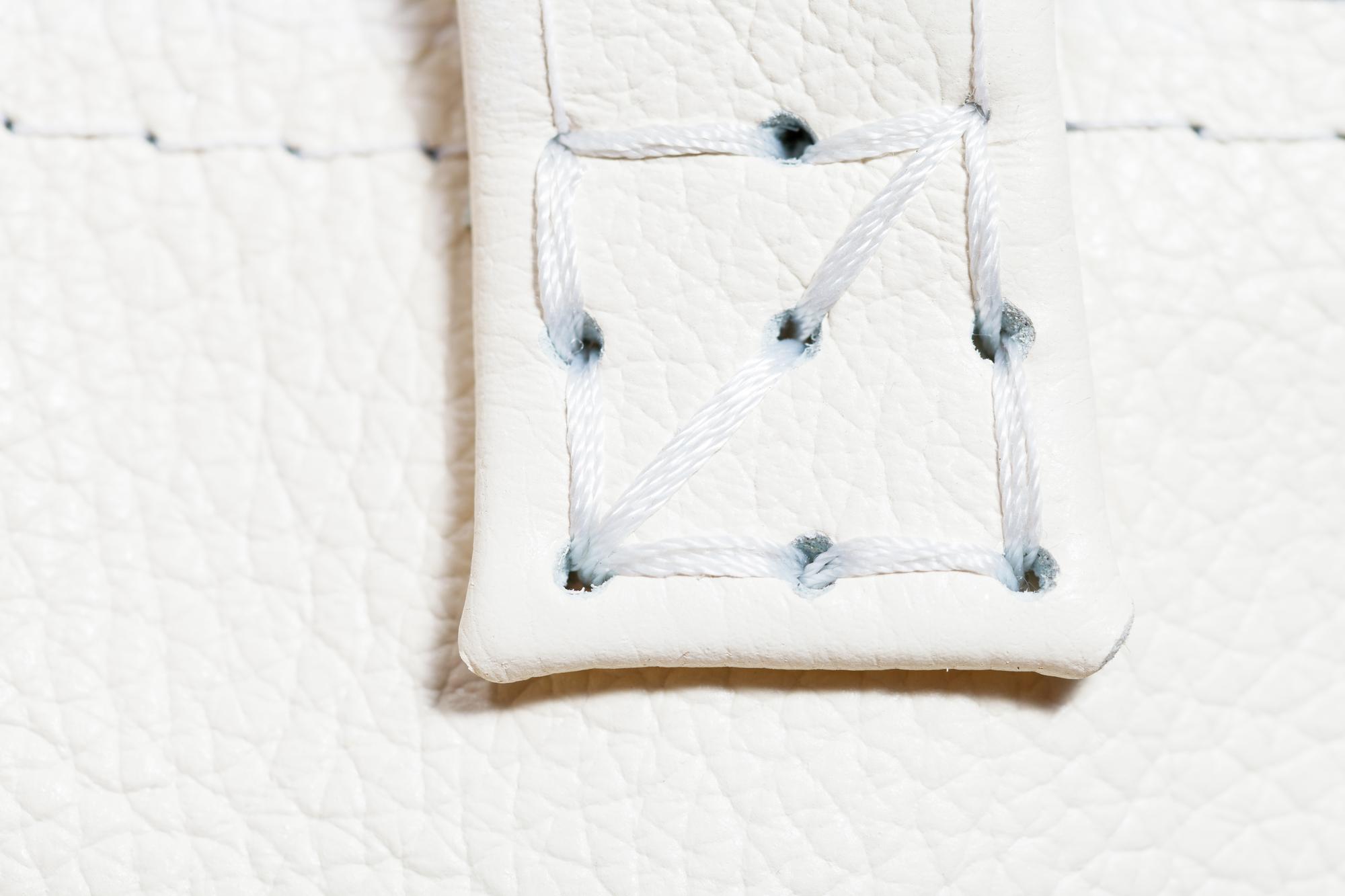 Custom embroidered label sewn into garment seam